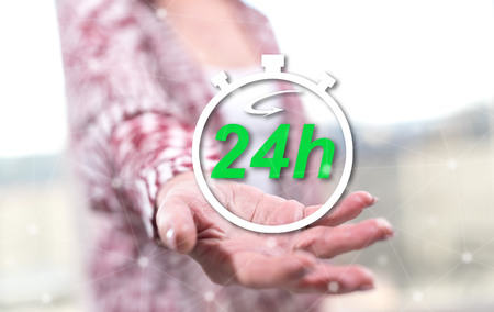 24h Fast delivery concept above the hand of a woman in background