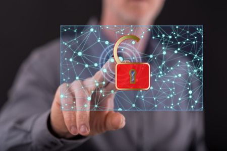 Man touching a network security concept on a touch screen with his fingerの写真素材