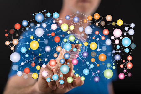 Man touching a social network concept on a touch screen with his finger