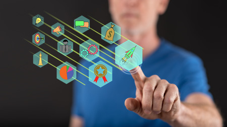 Man touching a business strategy concept on a touch screen with his finger