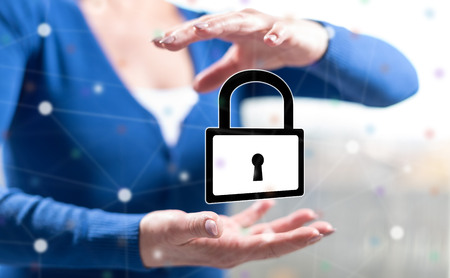 Cyber security concept between hands of a woman in backgroundの写真素材