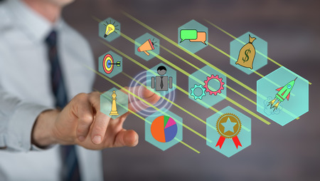 Man touching a business strategy concept on a touch screen with his fingerの写真素材