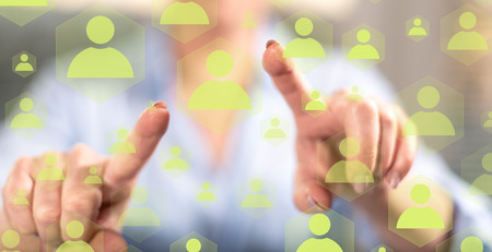 Woman touching a social network concept on a touch screen with her fingersの写真素材