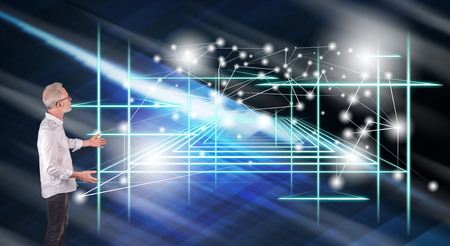 Businessman showing a virtual technology concept on a wall screen