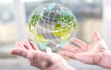 Global connection concept above the hands of a man