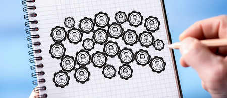Hand drawing teamwork concept on a notepad