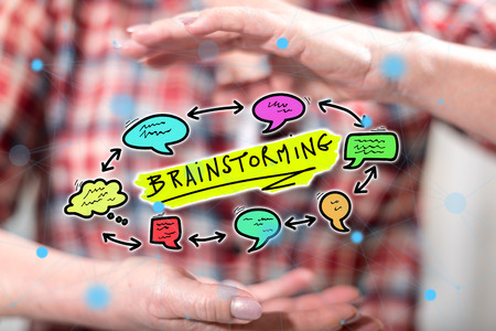 Brainstorming concept between hands of a woman in backgroundの写真素材