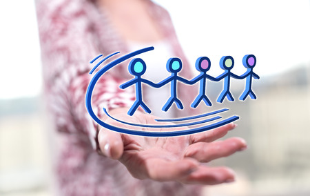 Teamwork concept above the hand of a woman in backgroundの写真素材