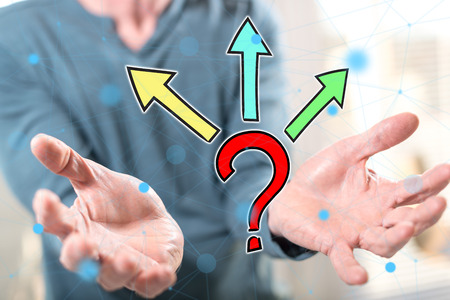 Choice concept above the hands of a man in background
