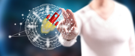 Woman touching a high technology startup on a touch screen with her fingersの写真素材