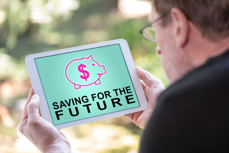 Tablet screen displaying a saving for the future conceptの写真素材
