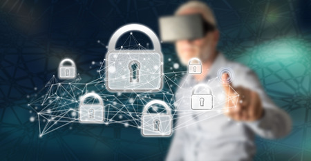 Man with vr headset touching a network security concept on a touch screen with his finger