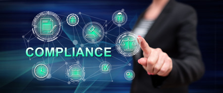 Woman touching a compliance concept on a touch screen with her fingerの写真素材