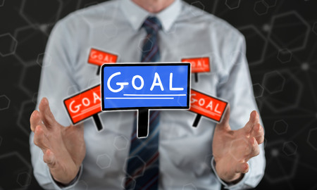 Goal concept between hands of a man in backgroundの写真素材