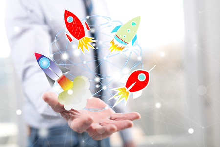 Start up concept above the hand of a man in background