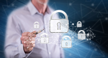 Man touching a network security concept on a touch screen with a pen