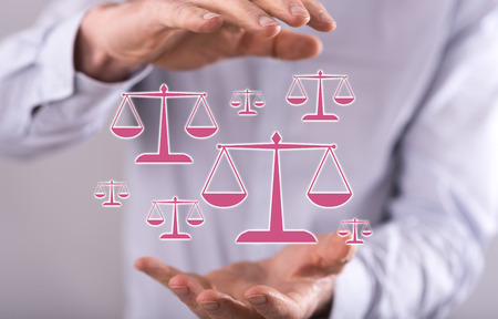 Law concept between hands of a man in backgroundの写真素材