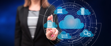 Woman touching a cloud computing concept on a touch screen with her fingers