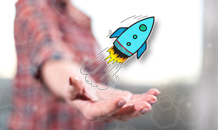 Start up concept above the hand of a woman in background