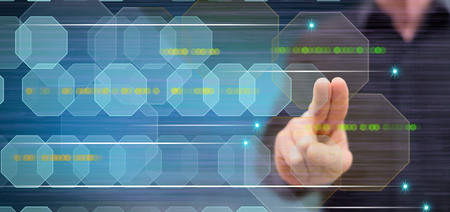 Man touching an abstract technology concept on a touch screen with his fingers