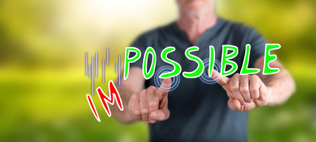 Man touching a challenge concept on a touch screen with his fingersの写真素材