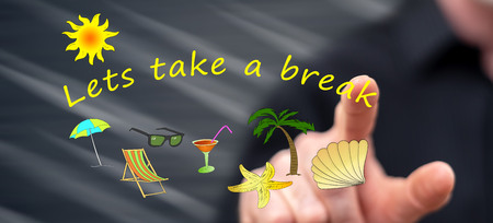 Man touching a vacation time concept on a touch screen with his fingerの写真素材