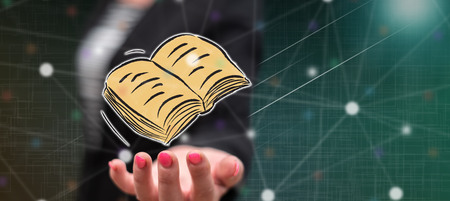 Education concept above the hand of a woman in background