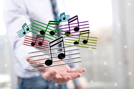 Music concept above the hand of a man in backgroundの写真素材