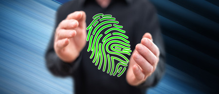 Fingerprint security system concept between hands of a man in background