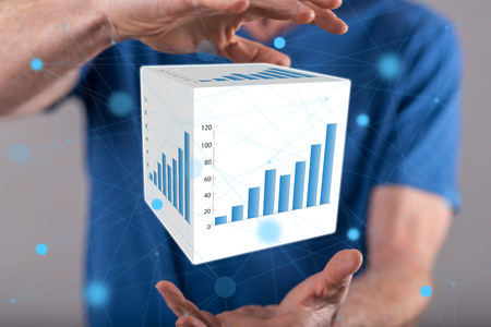 Business analysis concept between hands of a man in backgroundの写真素材
