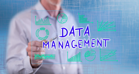 Man touching a data management concept on a touch screen with a penの写真素材