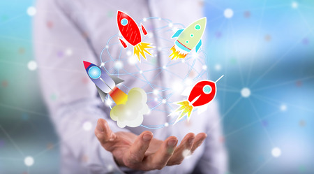 Start up concept above the hand of a man in background