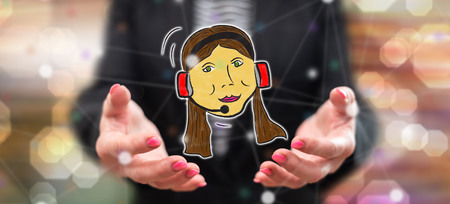 Phone support concept above the hands of a woman in backgroundの写真素材