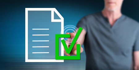 Man touching a compliance concept on a touch screen with his fingerの写真素材