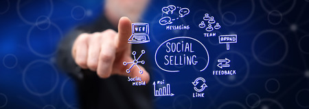 Man touching a social selling concept on a touch screen with his fingerの写真素材