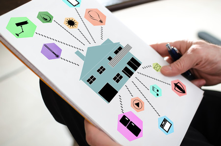 Smart home automation concept on a paper held by a hand