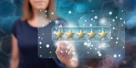 Woman touching a customer review concept on a touch screen with her finger