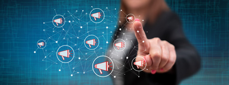 Woman touching a digital marketing concept on a touch screen with her fingerの写真素材