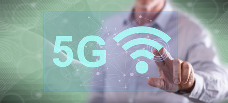 Man touching a 5g concept on a touch screen with his finger
