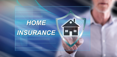 Man touching a home insurance concept on a touch screen with his fingerの写真素材