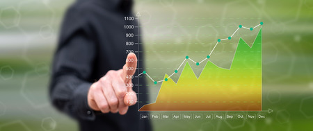 Man touching a financial results concept on a touch screen with his fingerの写真素材
