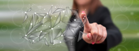 Woman touching a virtual network on a touch screen with her fingerの写真素材