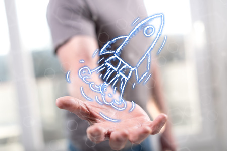 Start up concept above the hand of a man in backgroundの写真素材