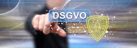 Man touching a gdpr concept (german text dsgvo) on a touch screen with his fingerの写真素材