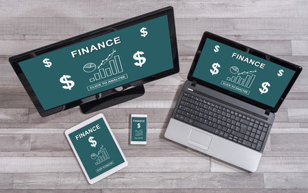 Finance concept shown on different information technology devicesの写真素材