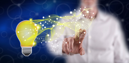 Man touching a technology innovation concept on a touch screen with his finger