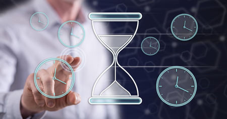 Man touching a time management concept on a touch screen with his finger