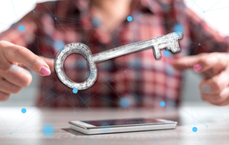 Smartphone with solution concept between hands of a woman in backgroundの写真素材