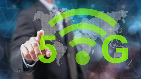 Man touching a 5g concept on a touch screen with his fingers