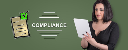Woman using digital tablet with compliance concept on backgroundの写真素材